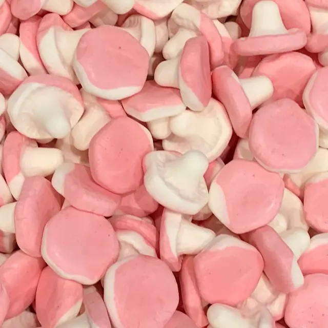 Pink and white foam candies shaped like mushrooms