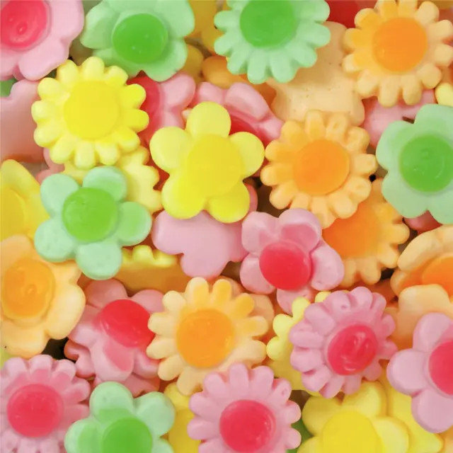 Pink, green, orange, and yellow flower-shaped gummies