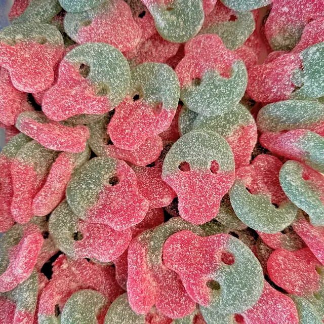 Red and green sugar-coated skull-shaped gummies
