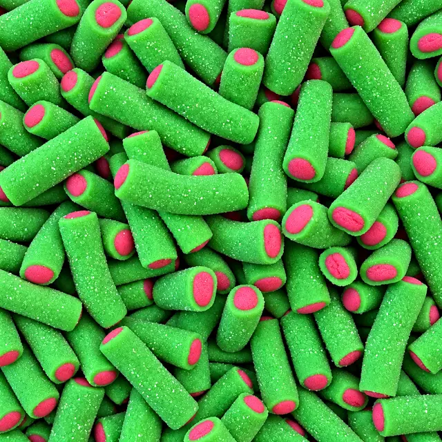Green sugar-coated candy rolls with pink centers