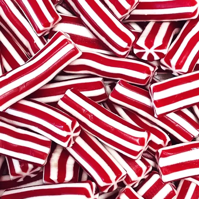 A pile of red and white striped candy twists