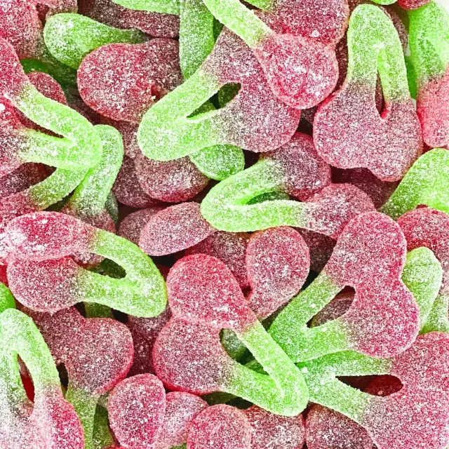 Red and green cherry-shaped gummies with a sugar coating