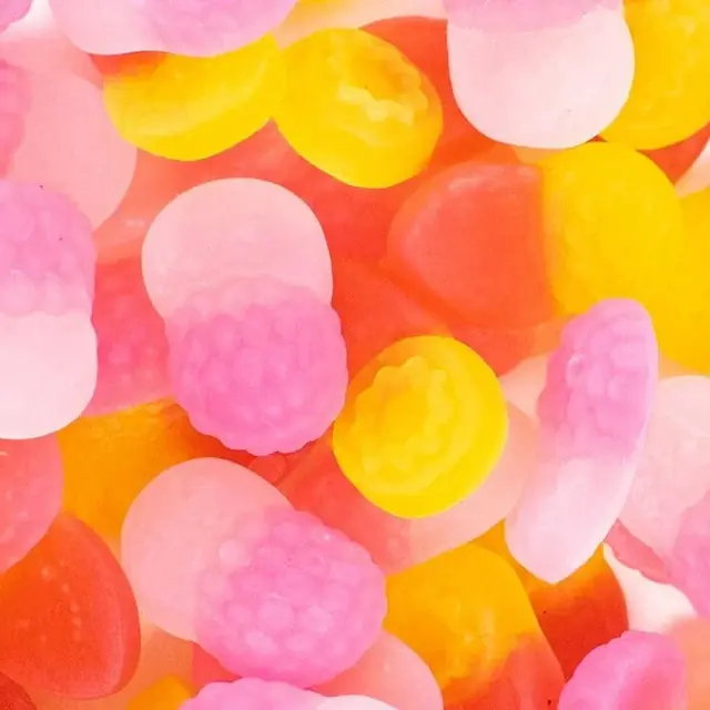 Pink, yellow, orange, and white fruit-shaped chewy candies