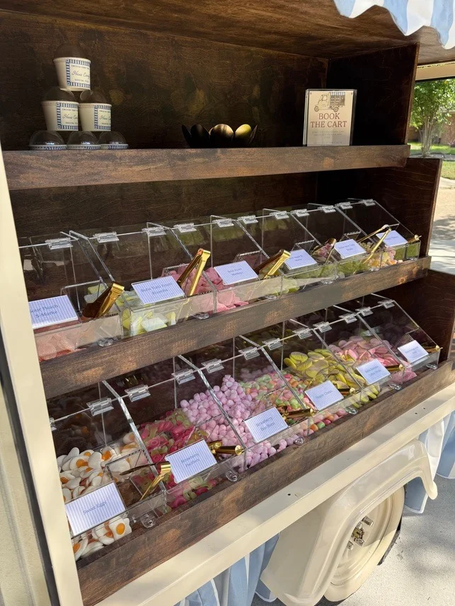 Rows of assorted candy in clear display bins